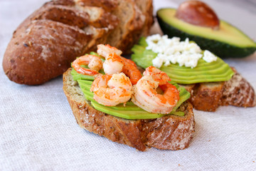 Healthy sandwiches with avocado and shrimp