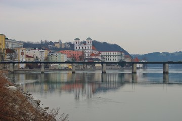 Panoramic view of Passau in February. The Inn river, bridge and old town. Bavaria, Germany, Europe.
