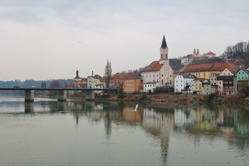 Naklejka na ściany i meble Passau in winter. View of the Inn river and the district Innstadt. Bavaria, Germany, Europe.