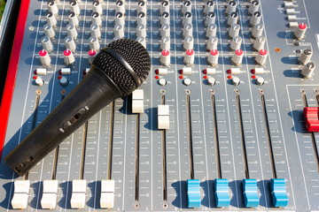 Close up Microphone on Mixing Console of a big HiFi system, The audio equipment and control panel...