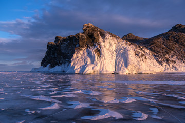Fototapeta na wymiar The icy rock on the shore of Lake Baikal