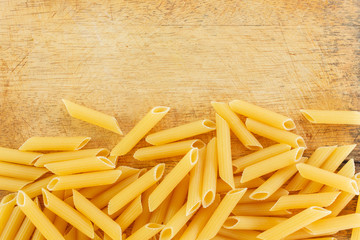 dry pasta penne Italian food wooden.