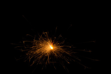 Bengal fire. New year sparkler candle on black background