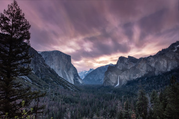 Beautiful dramatic colorful sunrise at Tunnel View in Yosemite National Park. Clouds streaking...