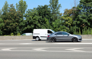 Fototapeta na wymiar road with vehicles passing
