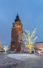 Obraz premium Krakow, Poland, Christmas decoration on Main Market Square and Town Hall tower