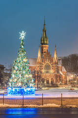 Krakow, Poland, Christmas tree on Podgorze Market Square and St Joseph church