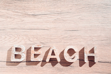 Summer Bacground With Beach Accessories On Wooden Board. White heart.