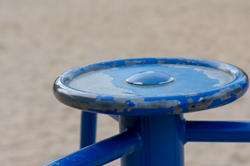 Old worn weathered blue metal centre disc