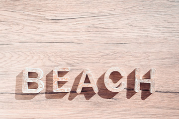 Summer Bacground With Beach Accessories On Wooden Board. White heart.