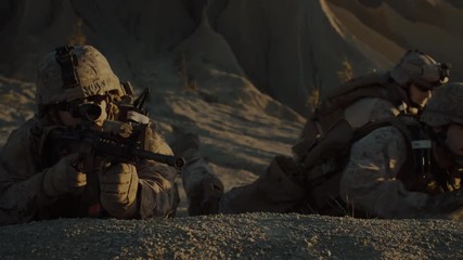 Squad of Fully Equipped, Armed Soldiers On a Reconnaissance Mission in the Desert Country. Team Crawls into Position of Best Enemy Visibility.