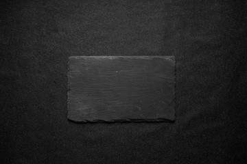 stone and slate on black background