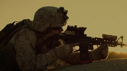 Squad of Fully Equipped, Armed Soldiers On a Reconnaissance Mission in the Desert Country. Team Crawls into Position of Best Enemy Visibility.
