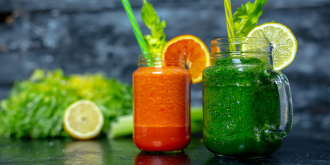 vegetable and fruit smoothies in various colors on a dark, warm background