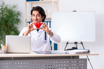 Young doctor cardiologist working in the clinic 