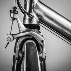 Fragment of a frame and parts of a road bike.