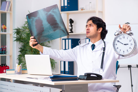 Young handsome doctor radiologist working in the clinic 