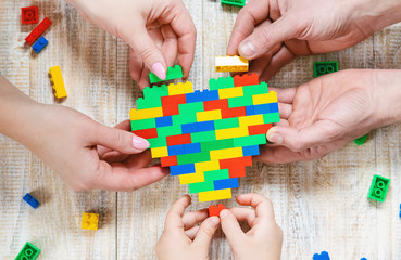 Build a designer blocks heart. Selective background.