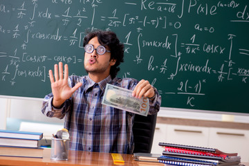 Funny male math teacher in the classroom 