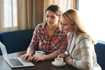 Girls in front of laptop