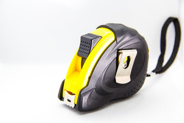 Fototapeta premium construction tool measuring tape on white background