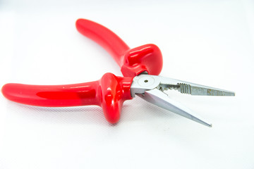 red pliers on white background