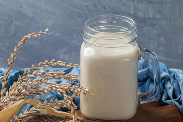 close up glass of milk on wooden table