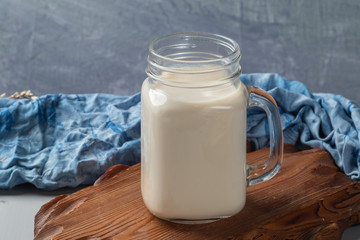 close up glass of milk on wooden table