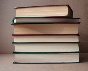 A stack of books on a crafting background. Education. Literature. Home library