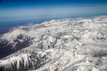 view from the plane window to the Caucasus mountains