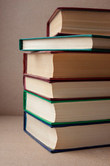 A stack of books on a crafting background. Education. Literature. Home library