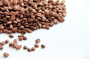 brown coffee beans on white background.