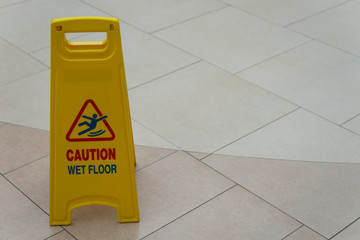 Safety sign with phrase caution wet floor Cleaning service