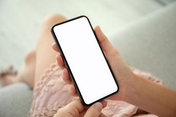 female hands in pink dress holding phone with isolated screen