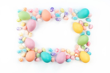 Happy Easter card. Frame with assorted sizes pastel easter eggs with copy space for text. Isolated flat lay on white background