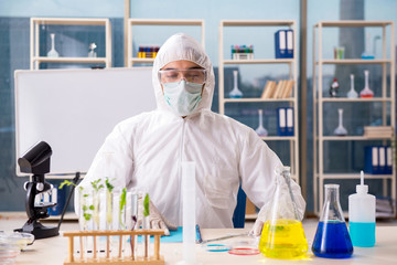 Male biotechnology scientist chemist working in the lab 