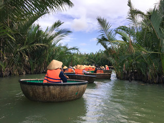 Tourists riding bamboo basket boats in Hoi An,vietnam