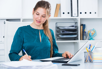 Young businesswoman at working place