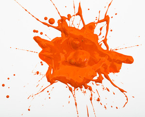 Blot and splashes of orange paint
