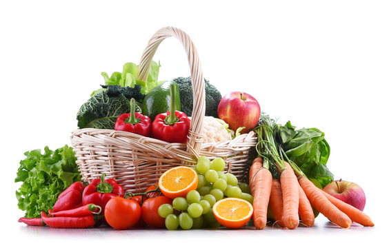 Fresh organic fruits and vegetables in wicker basket
