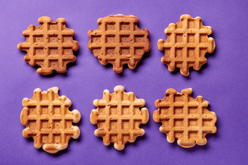 Homemade Viennese waffles on purple background