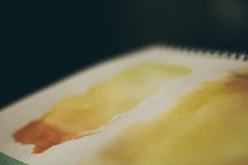 yellow watercolor blots in the album