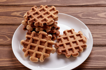Homemade Viennese waffles on wooden background