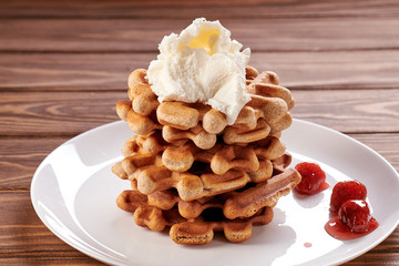 Homemade Viennese waffles with ice cream and strawberry jam