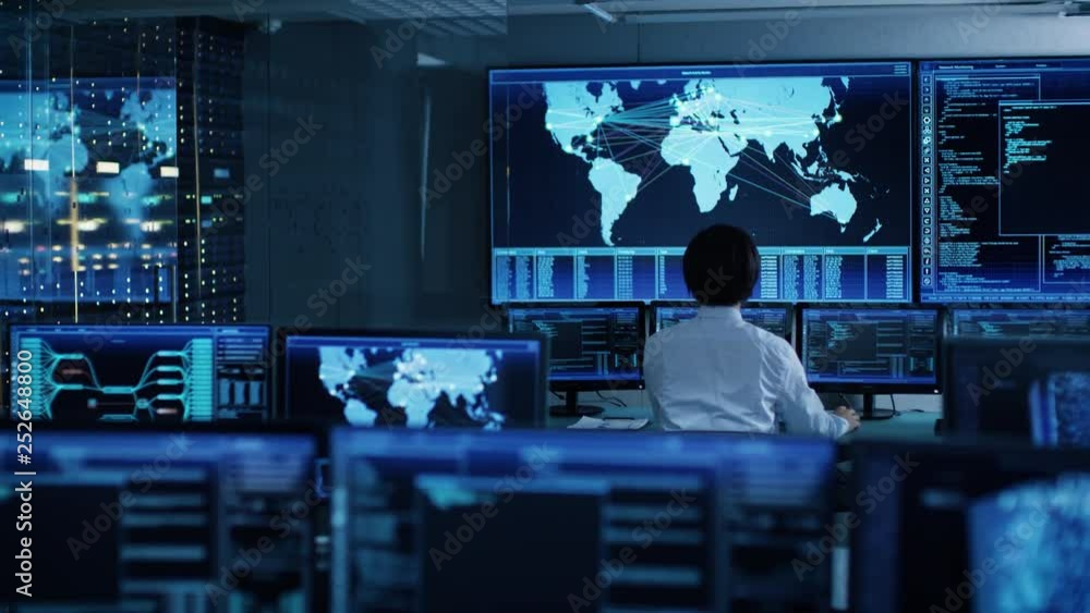 Poster In the System Control Room Chief Operator Watches Screens With Satellite Data. Monitoring Station Has Capacity for Global Data and Monitoring, Every Interaction is Shown in Real Time on Displays