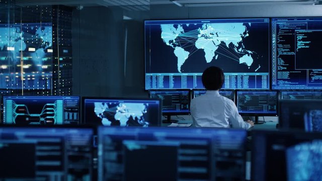 In the System Control Room Chief Operator Watches Screens With Satellite Data. Monitoring Station Has Capacity for Global Data and Monitoring, Every Interaction is Shown in Real Time on Displays