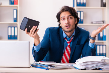 Young handsome businessman sitting in the office 