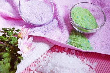 Obraz na płótnie Canvas Colorful bath salt on pink background.Healthy skin care.