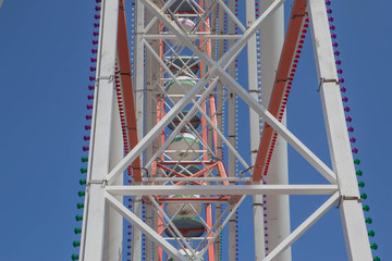 fragment A colourful ferris wheel. Brightly colored Ferris wheel