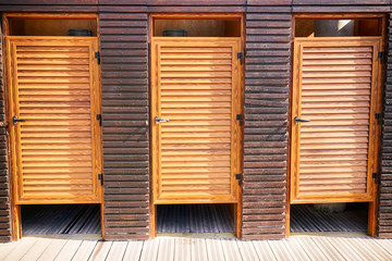 Three wooden doors to changing rooms